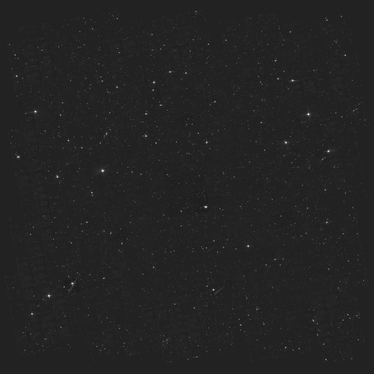 A wide-field view of deep space showing numerous stars, faint galaxies, and dark areas, including a jwst record distant galaxy, captured in high detail against a black background.