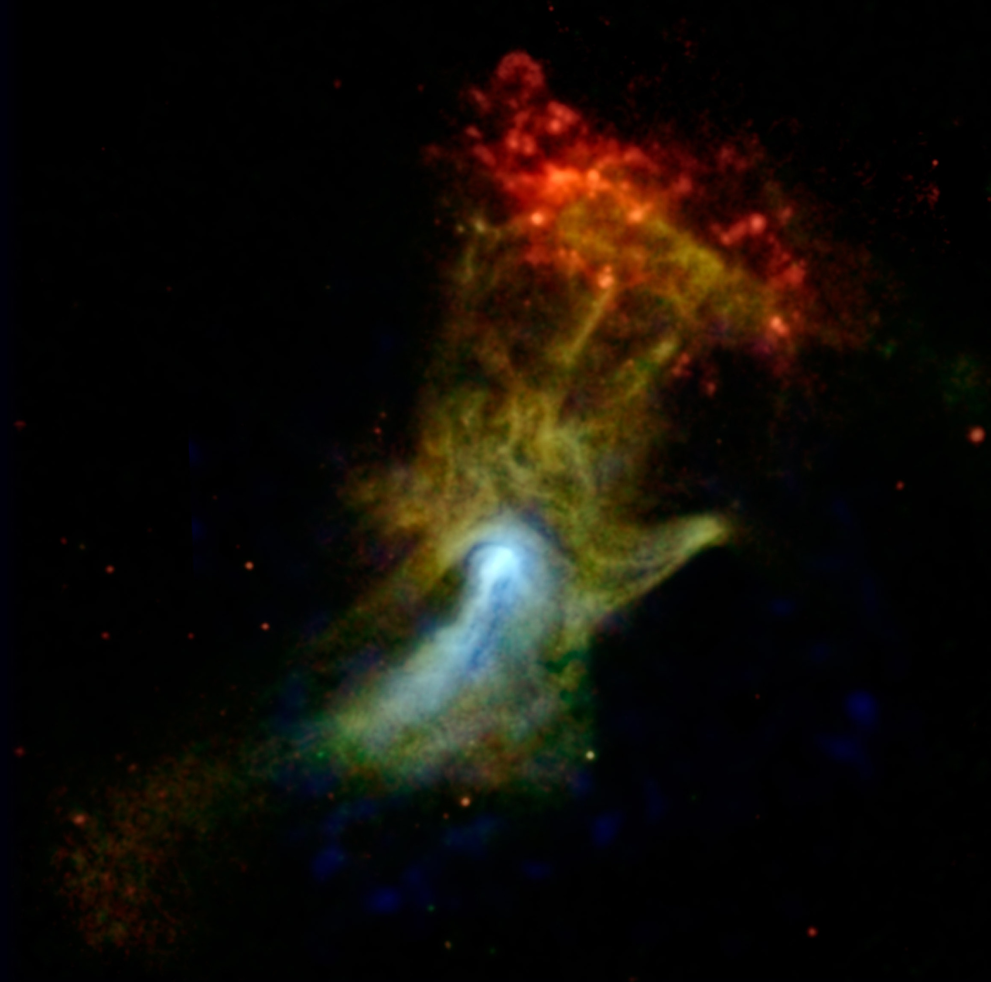 A colorful nebula in space forms a cloud resembling an outstretched hand, with red, yellow, green, and blue hues against a black backdrop&mdash;a stunning scene where space appearance can truly deceive the eye.