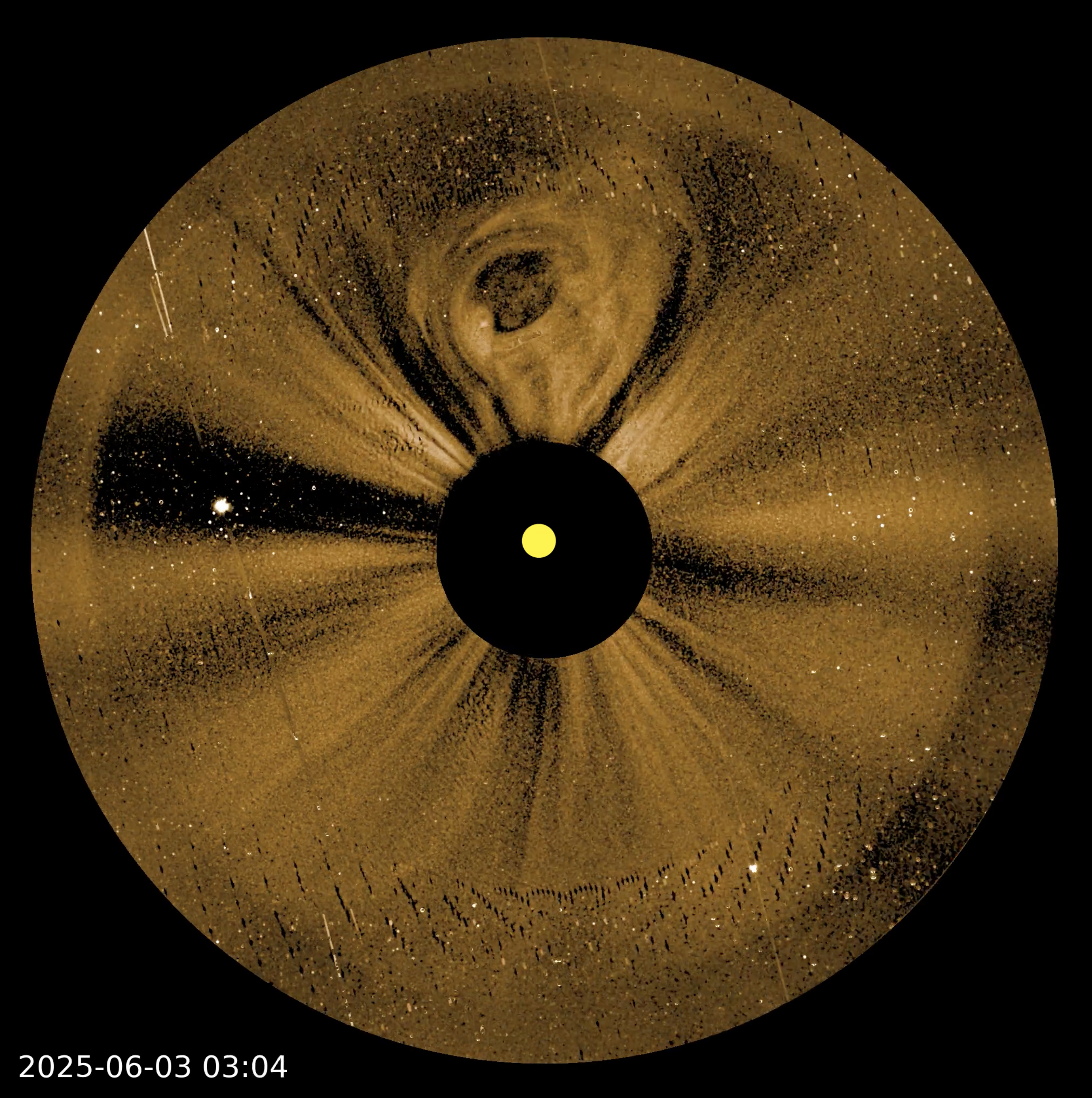 Circular solar observation image shows the sun at the center with bright and dark radial patterns, dated 2025-06-03 03:04, suggesting solar activity or coronal mass ejection&mdash;similar to imagery seen in NASA PUNCH video sun corona footage.