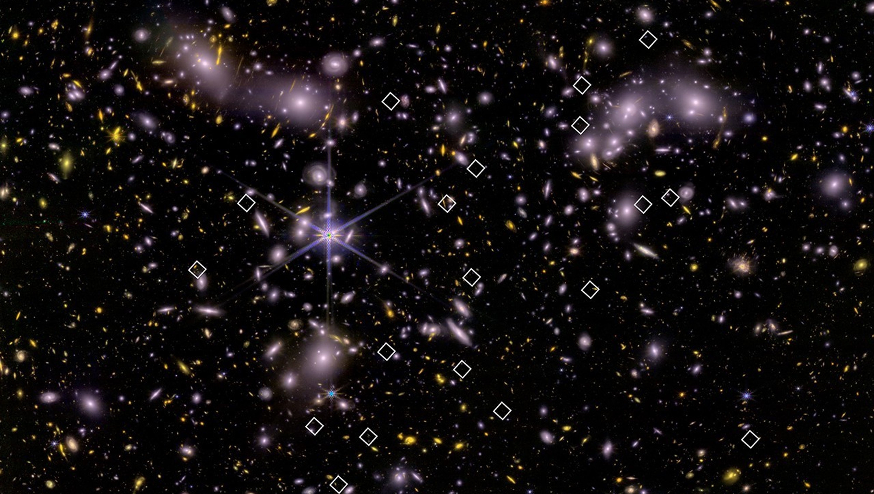 A dense star field and distant galaxies with bright galaxy clusters and several white squares highlighting specific points in the image.