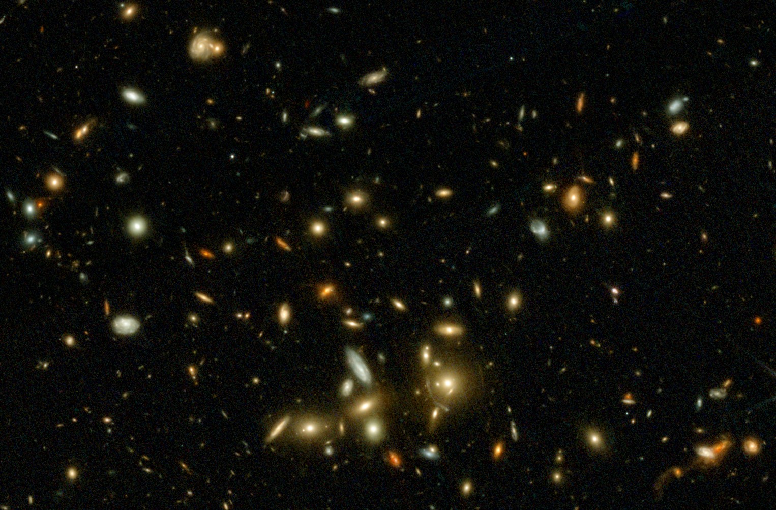 A dense field of distant galaxies, unveiled by JWST science, varies in color and brightness, scattered across a dark background in deep space.