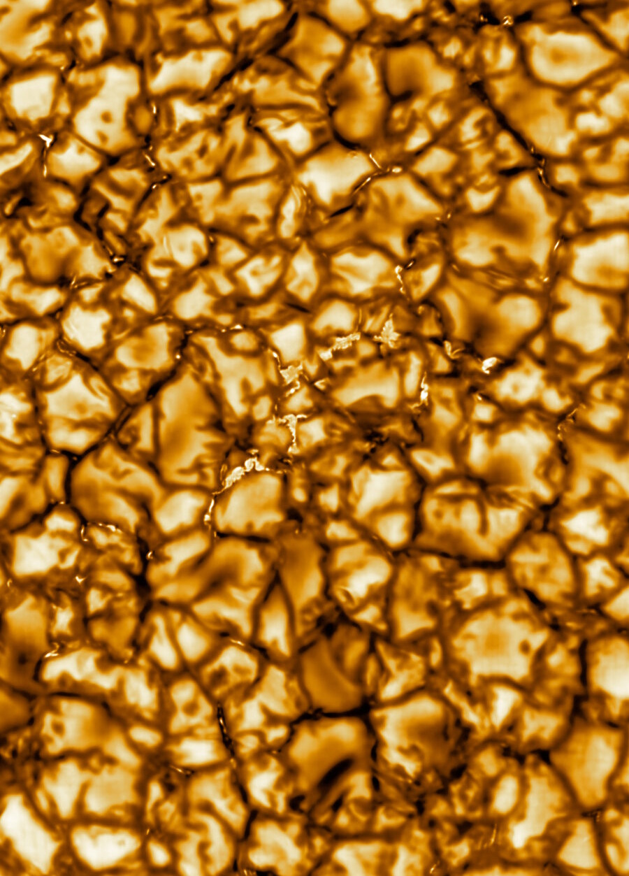 Close-up image of the Sun's surface shows a granular, textured pattern in shades of gold and brown, representing convection cells called granules&mdash;similar to those highlighted in recent NASA PUNCH video sun corona footage.