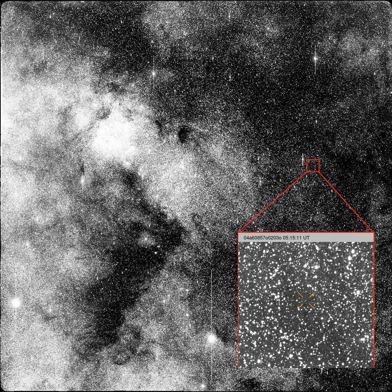 Black-and-white image of a dense star field with a zoomed-in inset highlighting a smaller region containing the marked third interstellar object, complete with an identification label and timestamp.