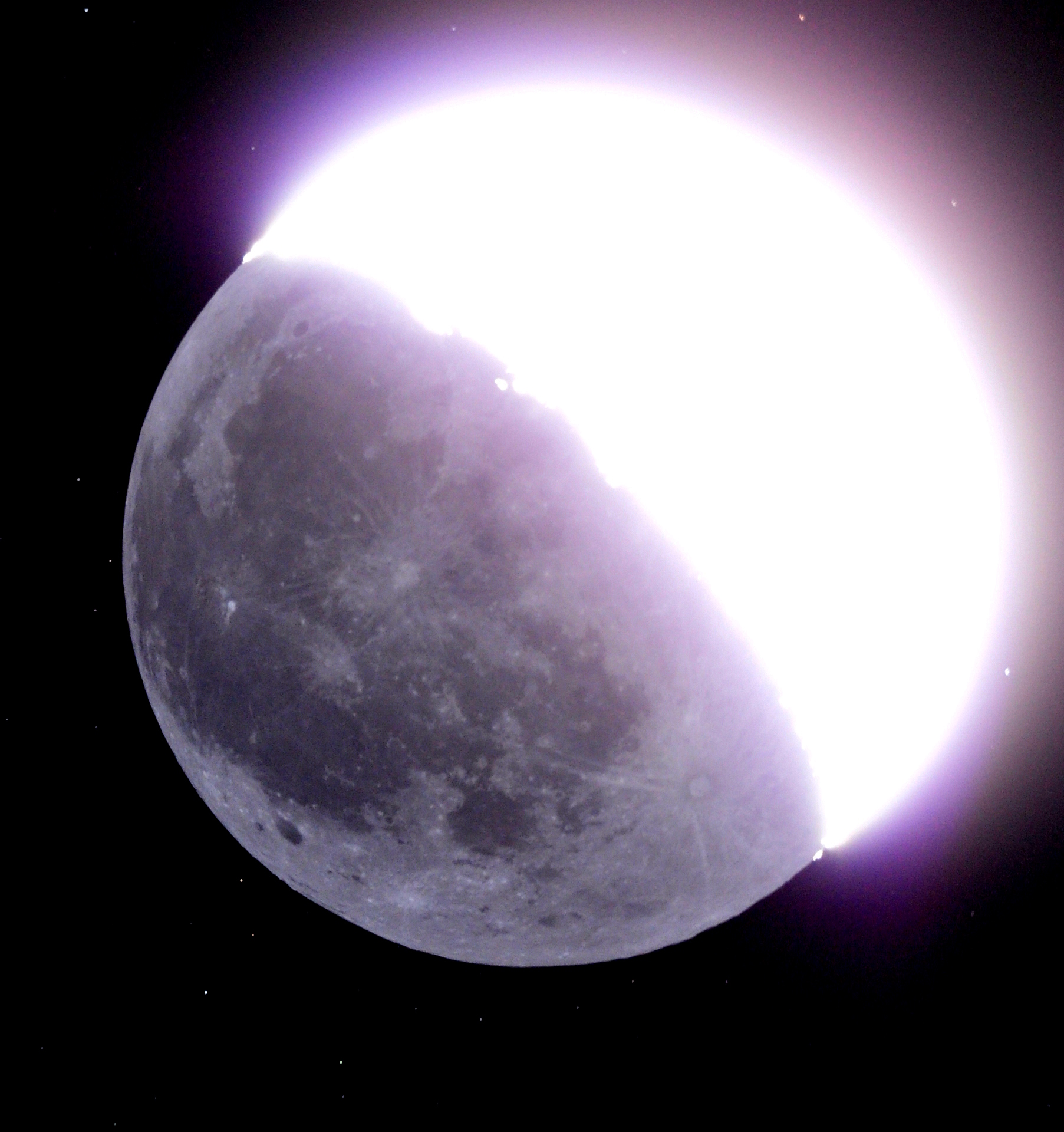 A photo of the Moon during a partial lunar eclipse, perfect for illustrating 5 science lessons; the Earth's shadow covers most of its surface, leaving a bright, illuminated edge visible.