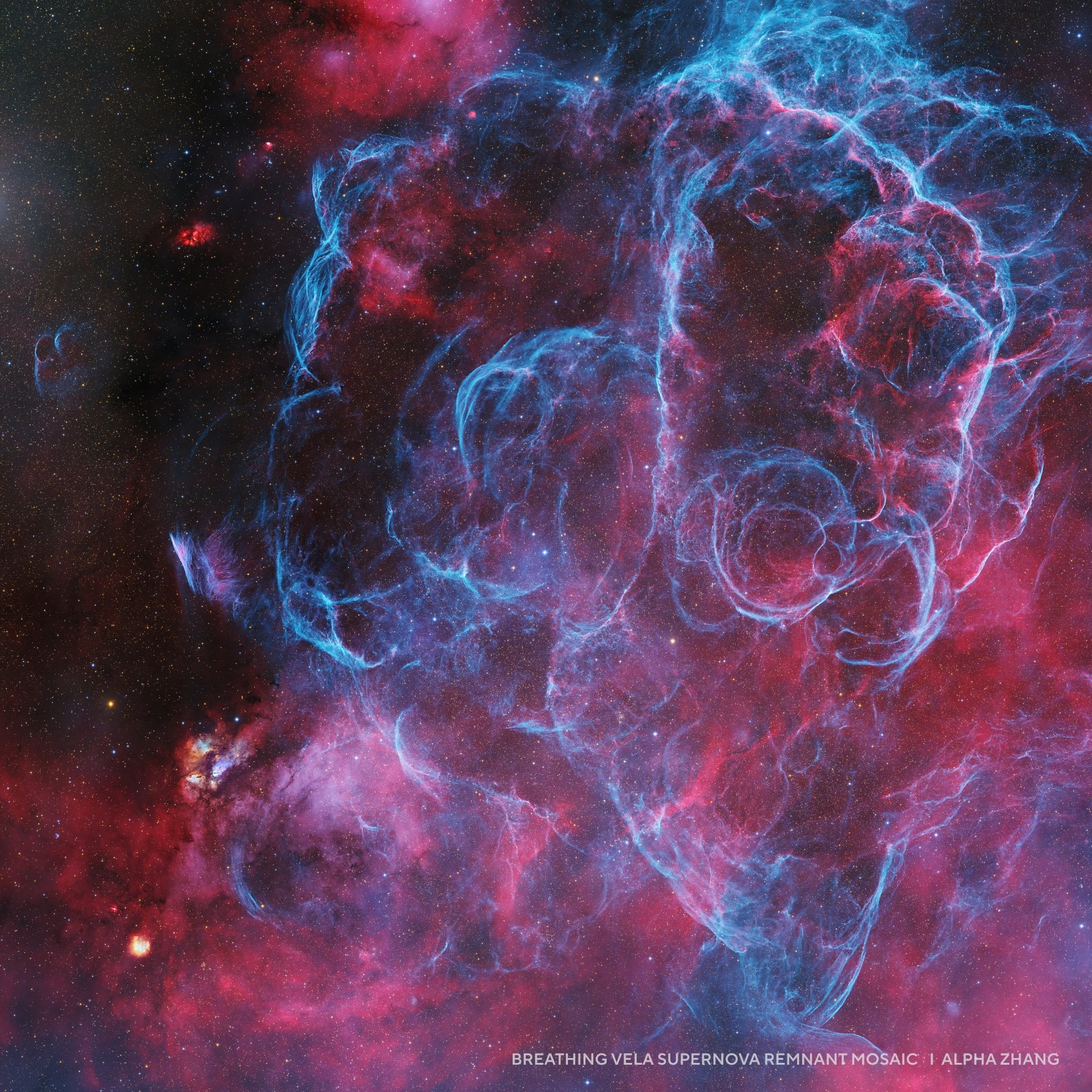 Colorful nebula with bright blue and pink swirling gas clouds in deep space, depicting the Vela supernova remnant mosaic&mdash;an inspiring feature among 2025 night sky images.