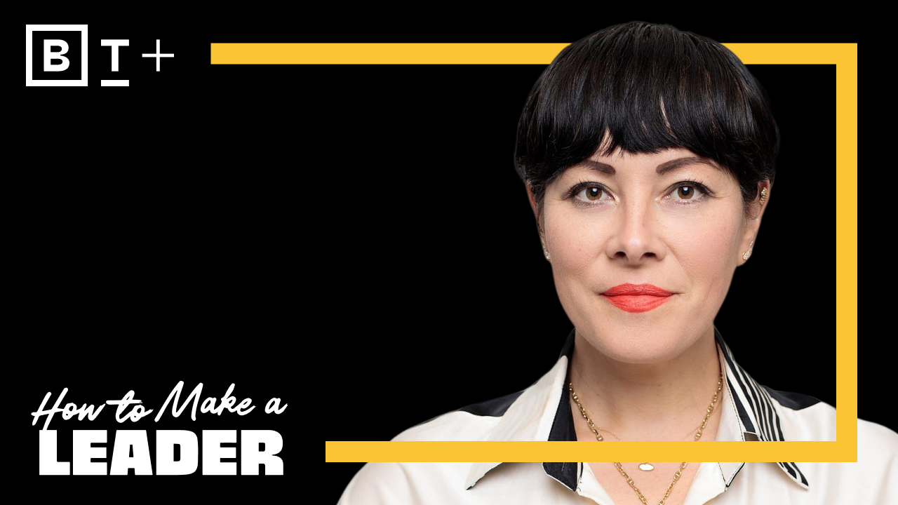 A woman with short dark hair and red lipstick faces forward against a black background with yellow borders and the text "How to Make a Leader" in the corner.