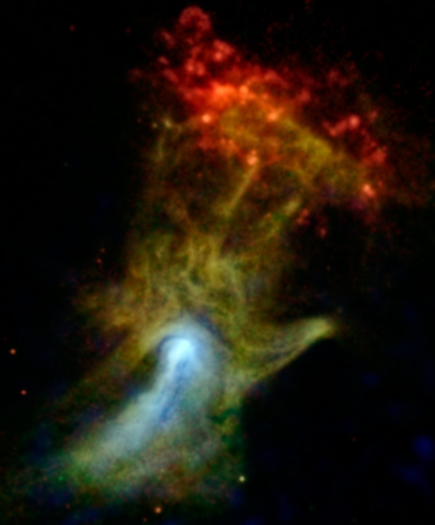 Color-enhanced image of a nebula shaped like the Hand of God, with red, yellow, and green gas clouds against a black background&mdash;sculpted by a dead star.