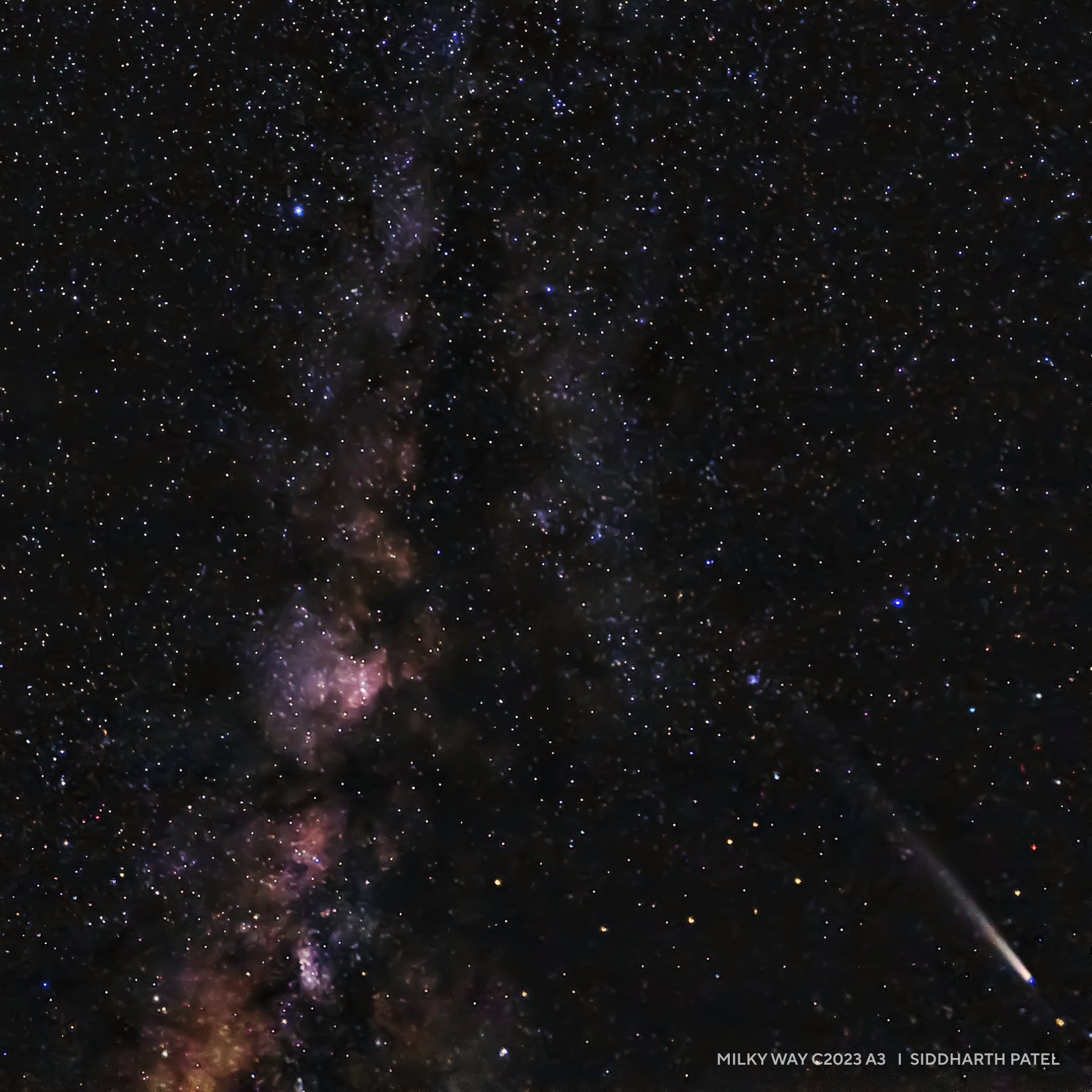 A night sky featuring the Milky Way galaxy, dense clusters of stars, and a bright meteor streaking across the lower right corner&mdash;perfect for those seeking inspiring 2025 night sky images.