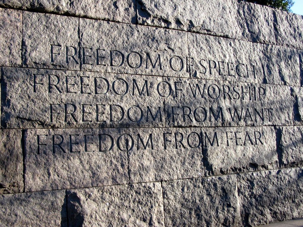 Stone wall engraved with the words: "Freedom of Speech, Freedom of Worship, Freedom from Want, Freedom from Fear.