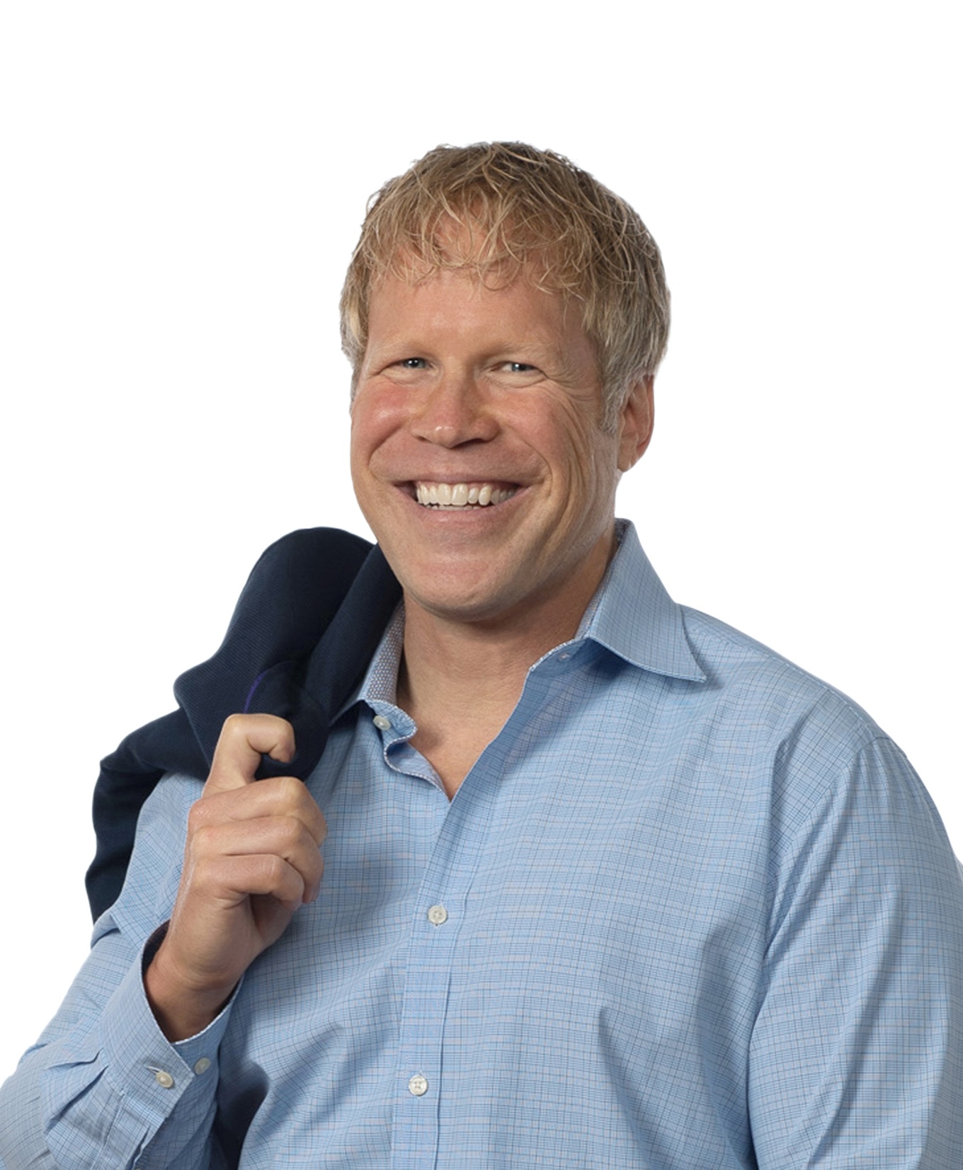 Smiling man with blond hair in a light blue button-down shirt holds a dark jacket over his shoulder against a white background.