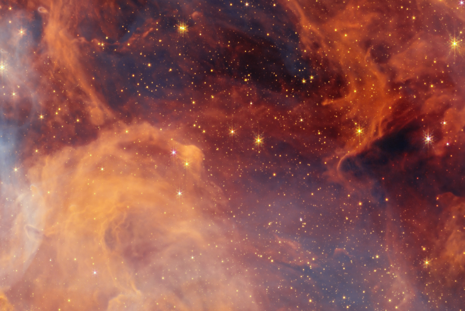 A detailed image of a colorful nebula, captured by JWST, with orange, purple, and blue clouds of gas, scattered with numerous bright stars resembling the stunning Pismis 24 cluster.