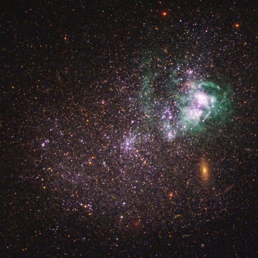 A colorful, irregular galaxy with bright clusters of stars, some possibly from a generation stars before sun, and nebulae against a dark background scattered with distant stars.