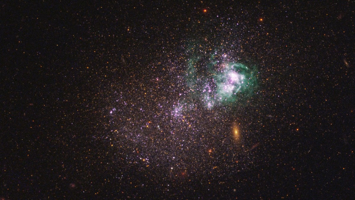 A colorful, irregular galaxy with bright clusters of stars, some possibly from a generation stars before sun, and nebulae against a dark background scattered with distant stars.