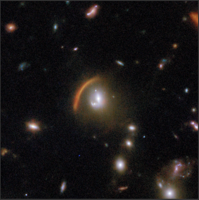 Several galaxies and a prominent red-orange arc of light, likely caused by a gravitational lens, are visible against a dark background in deep space&mdash;an image captured by the COSMOS-Web project using the JWST.