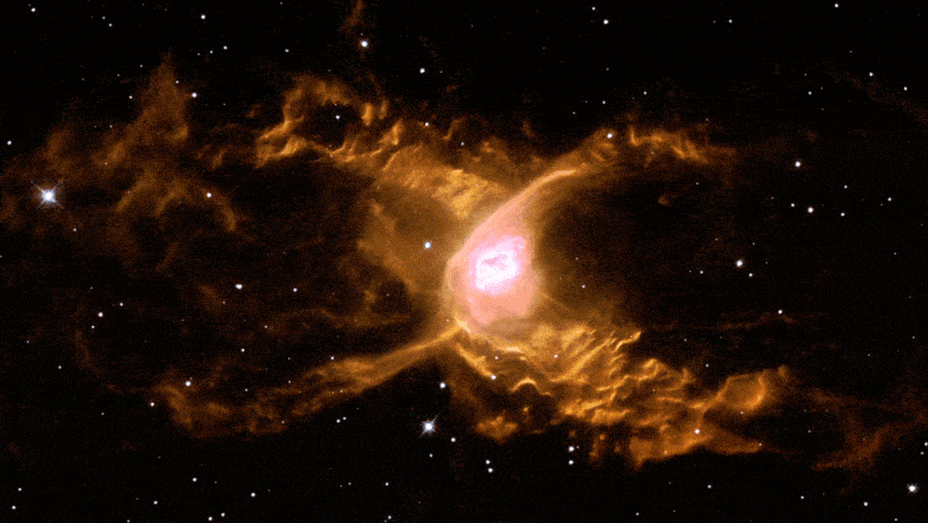 A bright pink and orange nebula with cloud-like structures and scattered stars in the background, set against a dark space backdrop.