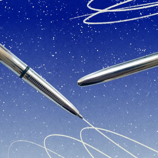 A silver space pen with its cap removed appears to write swirling white lines against a blue, starry background.