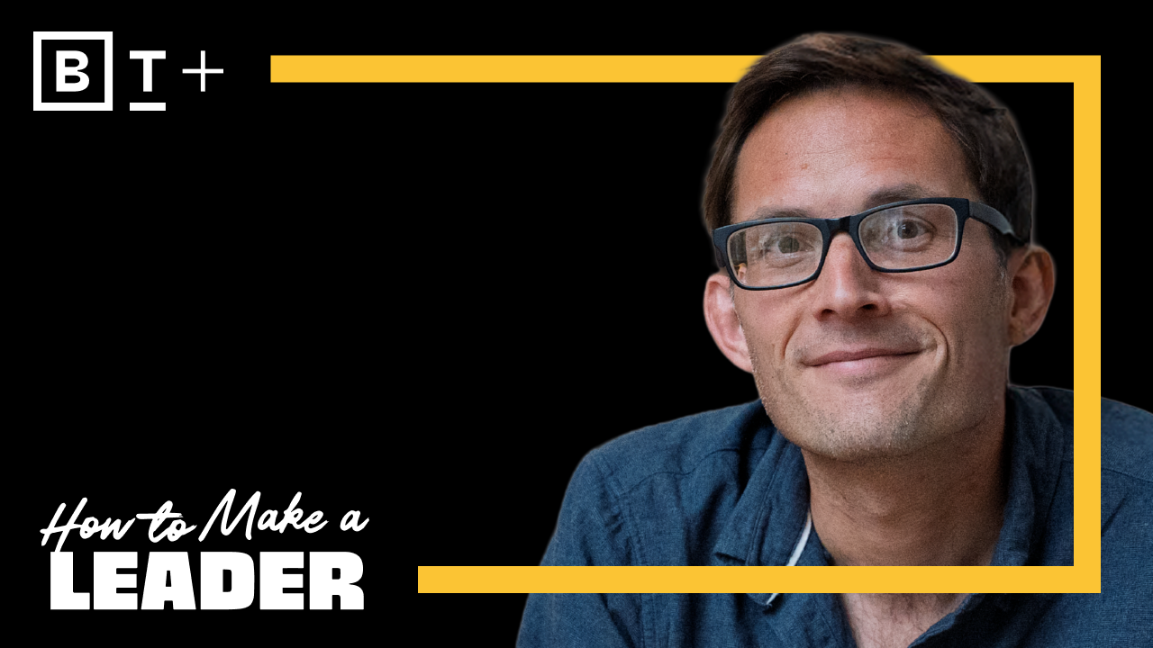 A man wearing glasses and a blue shirt looks at the camera. Bold text reads “How to Make a Leader” with a yellow border and “BT+” logo on a black background.