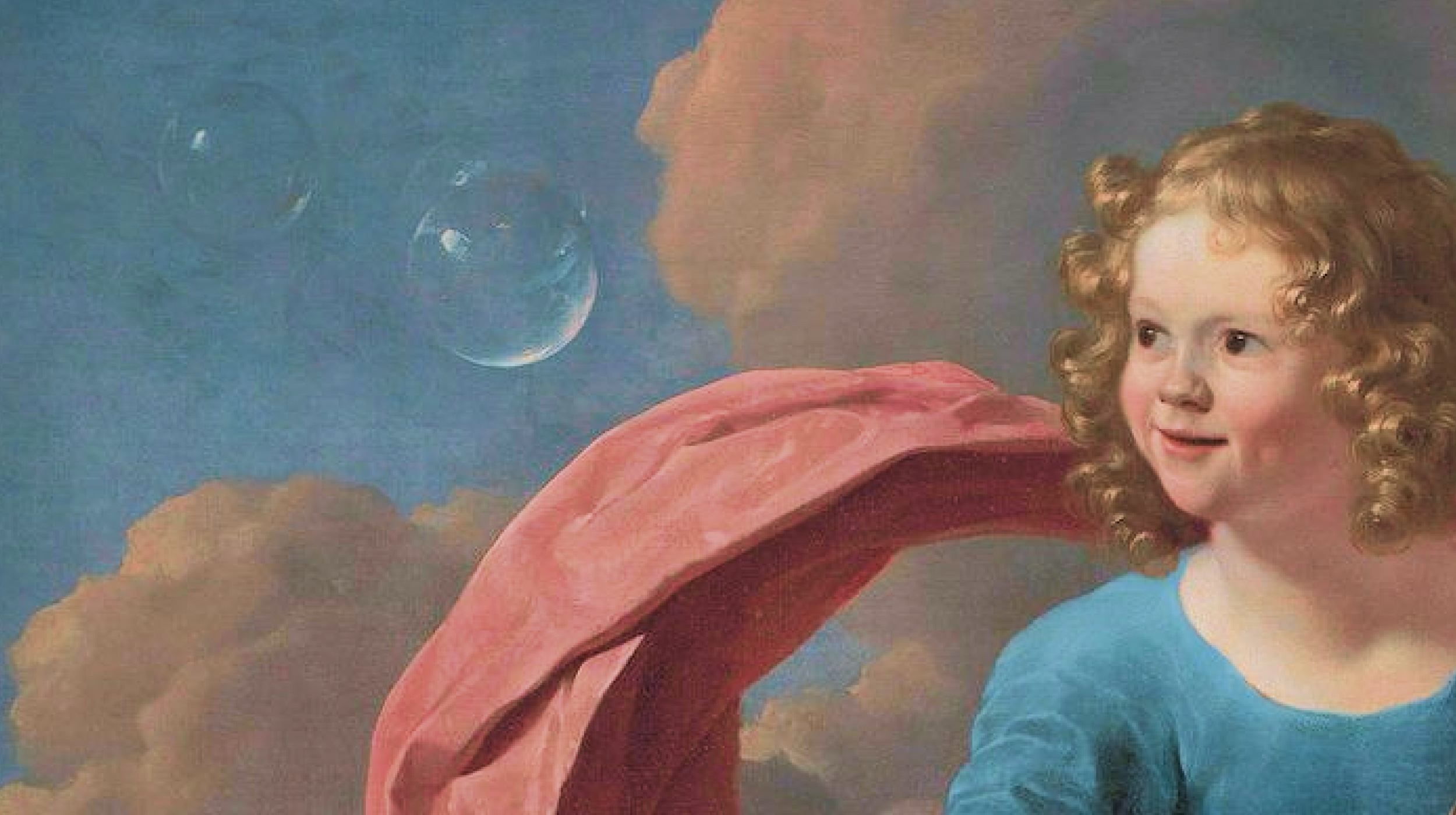 A young child with curly hair and a blue shirt stands in front of a cloudy sky with two floating soap bubbles and a pink fabric draped behind them.