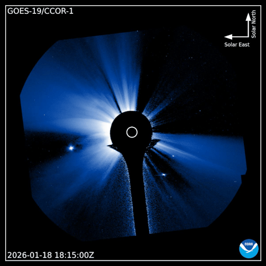 A blue-toned image from GOES-19/CCOR-1 shows the Sun&rsquo;s corona with light bursts&mdash;possibly linked to a solar radiation storm&mdash;timestamped 2026-01-18 18:15:00Z, with directional arrows for north and solar east.