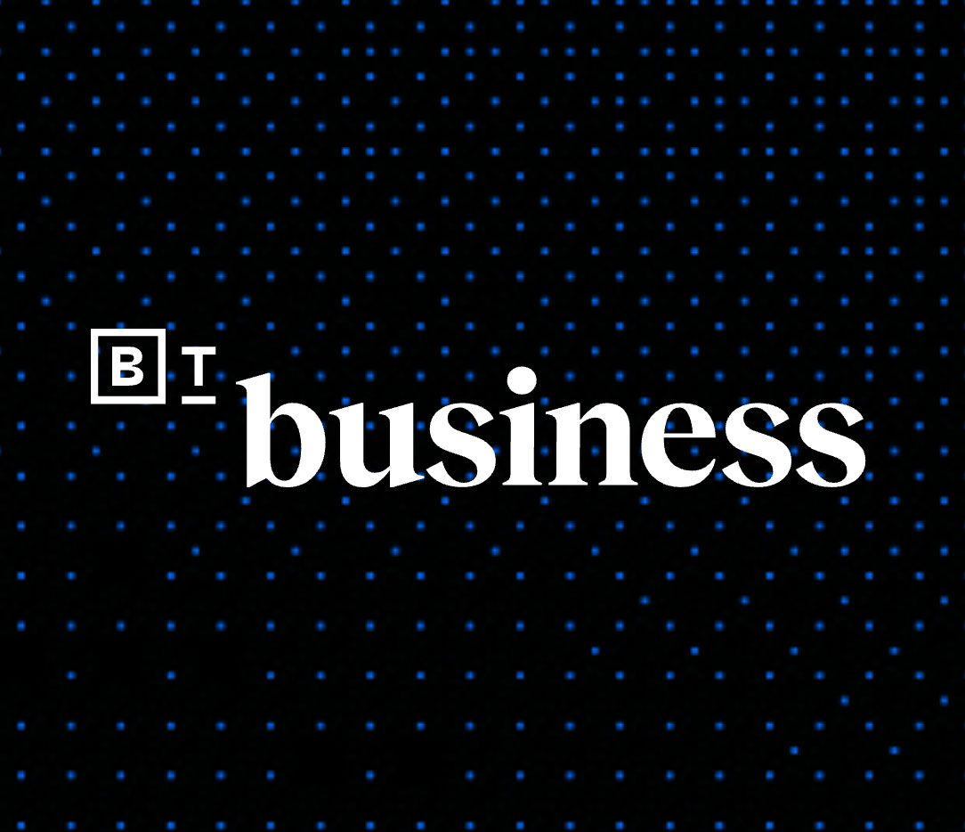 White text "B T business" on a black background with a grid of small blue dots. The letters "B" and "T" are enclosed in square borders.