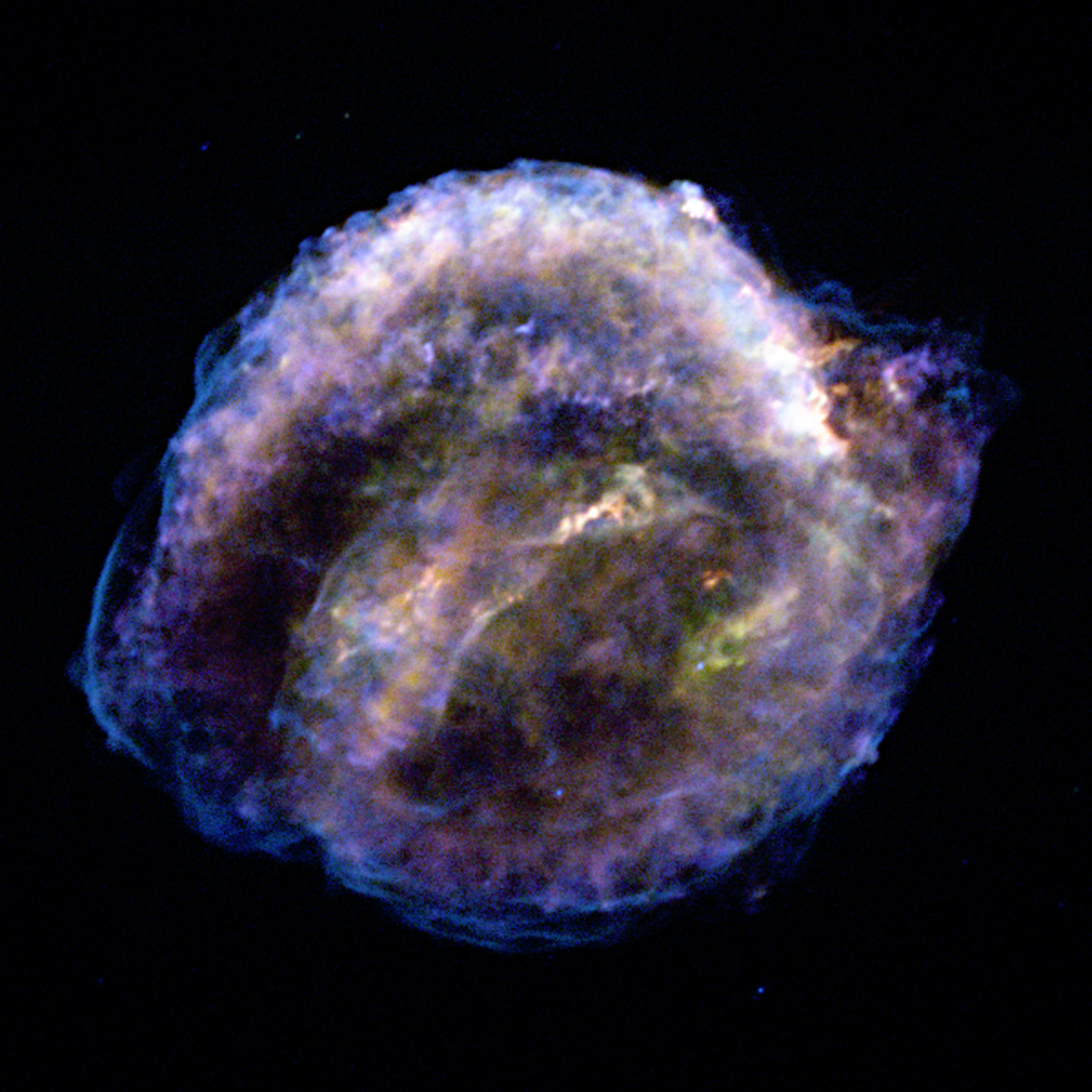 A colorful nebula-like structure against a black background, showing wispy, cloud-like patterns of blue, purple, and yellow light&mdash;captured by NASA Chandra as Kepler's supernova remnants expand over 25 years.