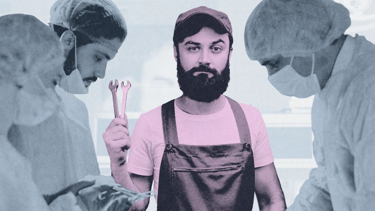 A man in overalls, an example of epistemic trespassing, holds wrenches while standing between surgeons in scrubs and masks performing surgery.