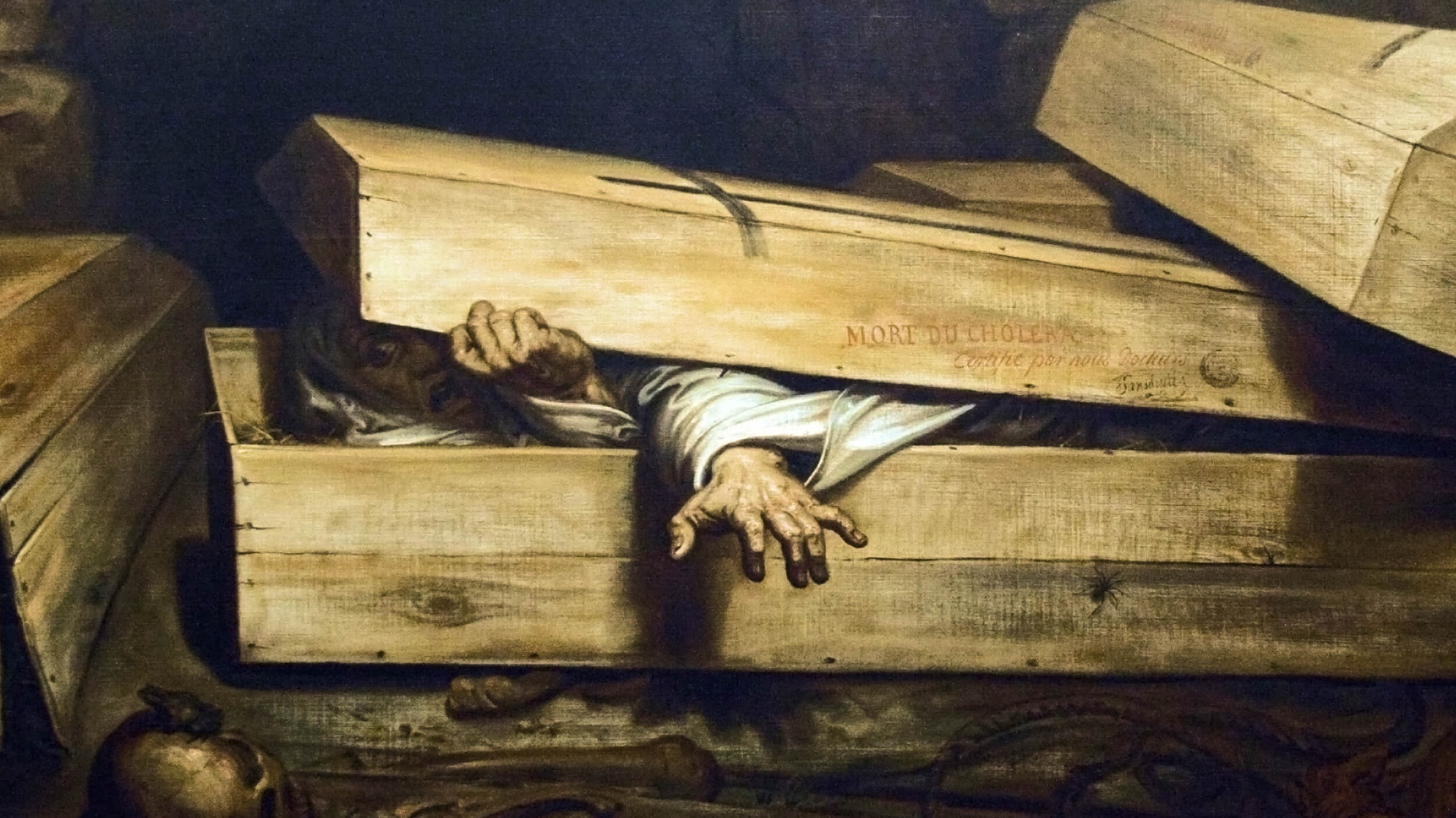 A person in white clothing is partially emerging from a wooden coffin, one hand gripping the lid and the other reaching out, evoking a sense of nostalgia for stories of the past.
