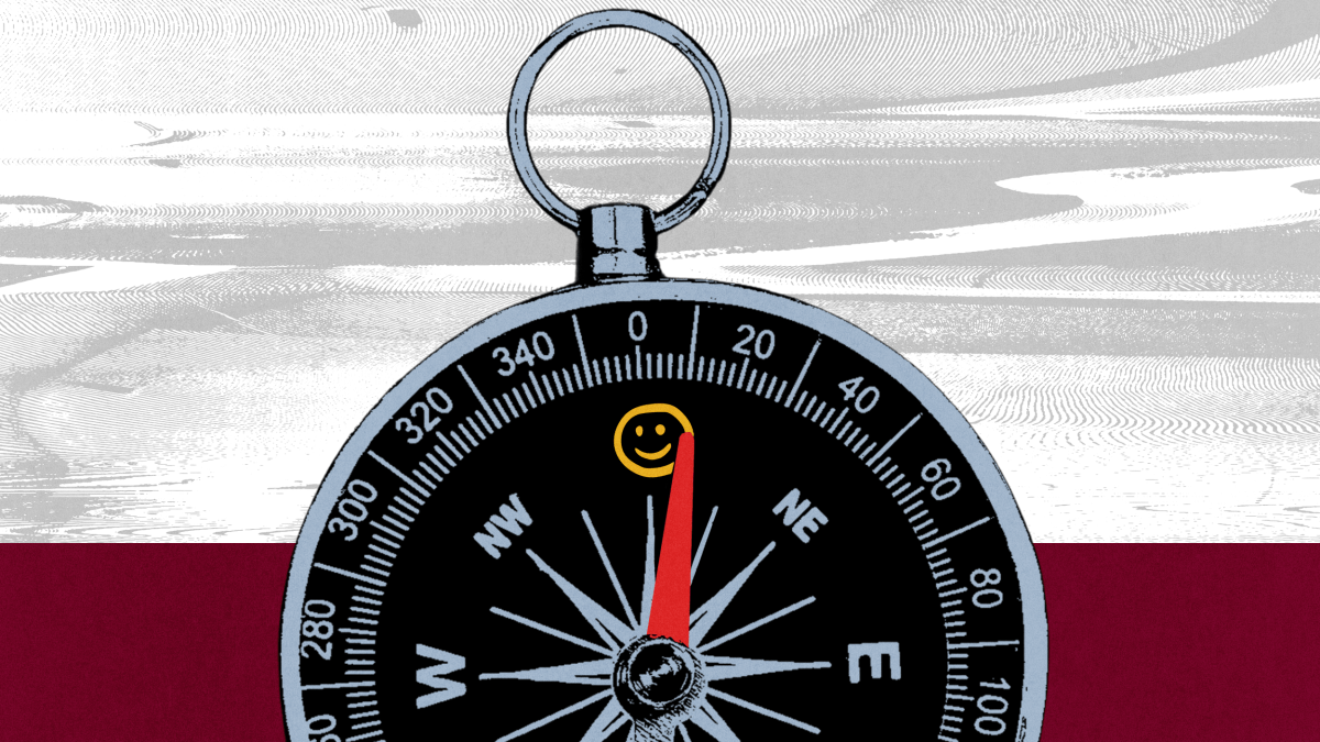 A compass with a red needle points north toward a yellow smiley face symbol, signifying happiness, on a textured background with gray, white, and red horizontal sections.