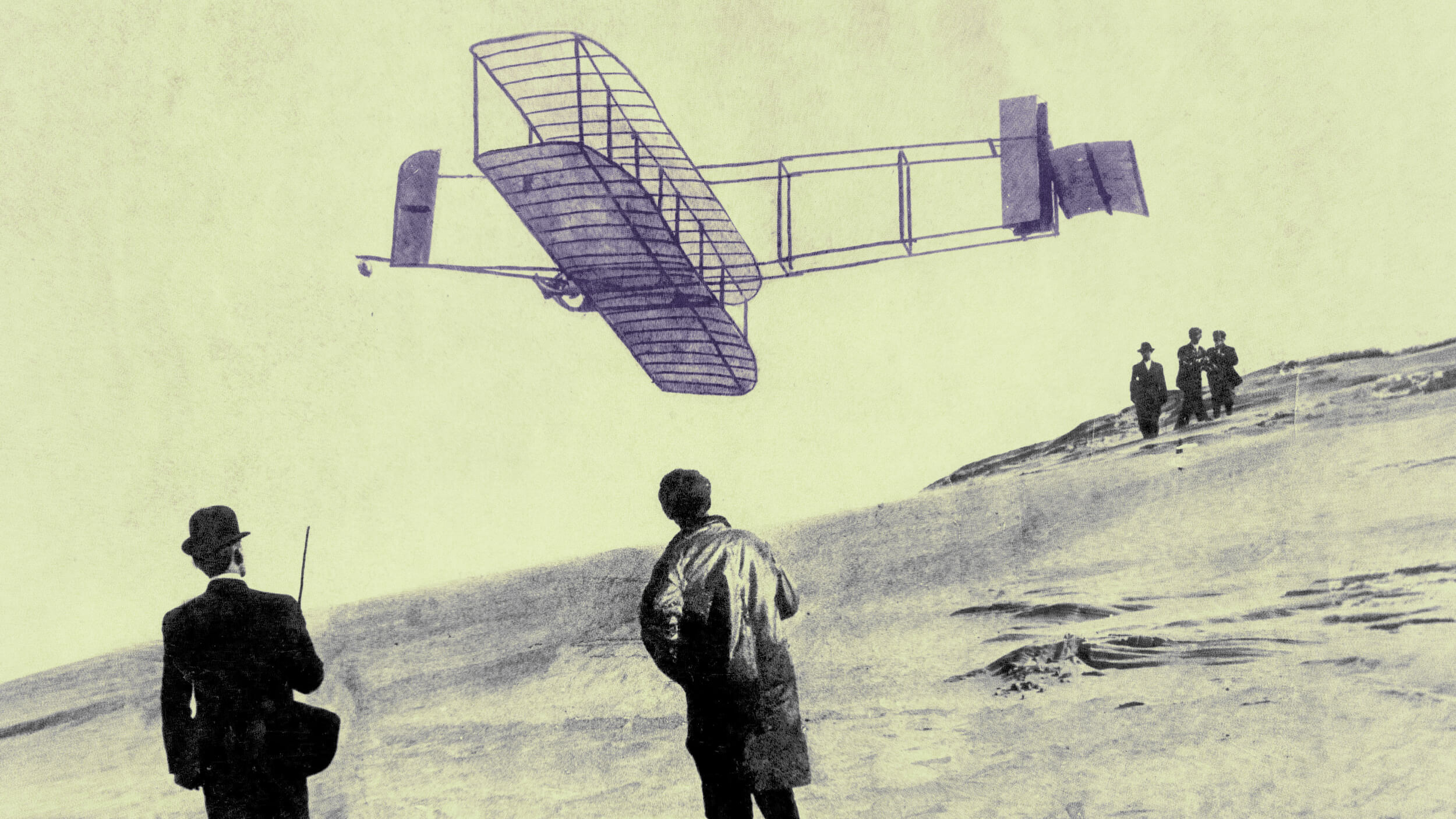 A vintage photograph shows a Wright Brothers-era biplane flying low over a sandy hill as four people on the ground watch.
