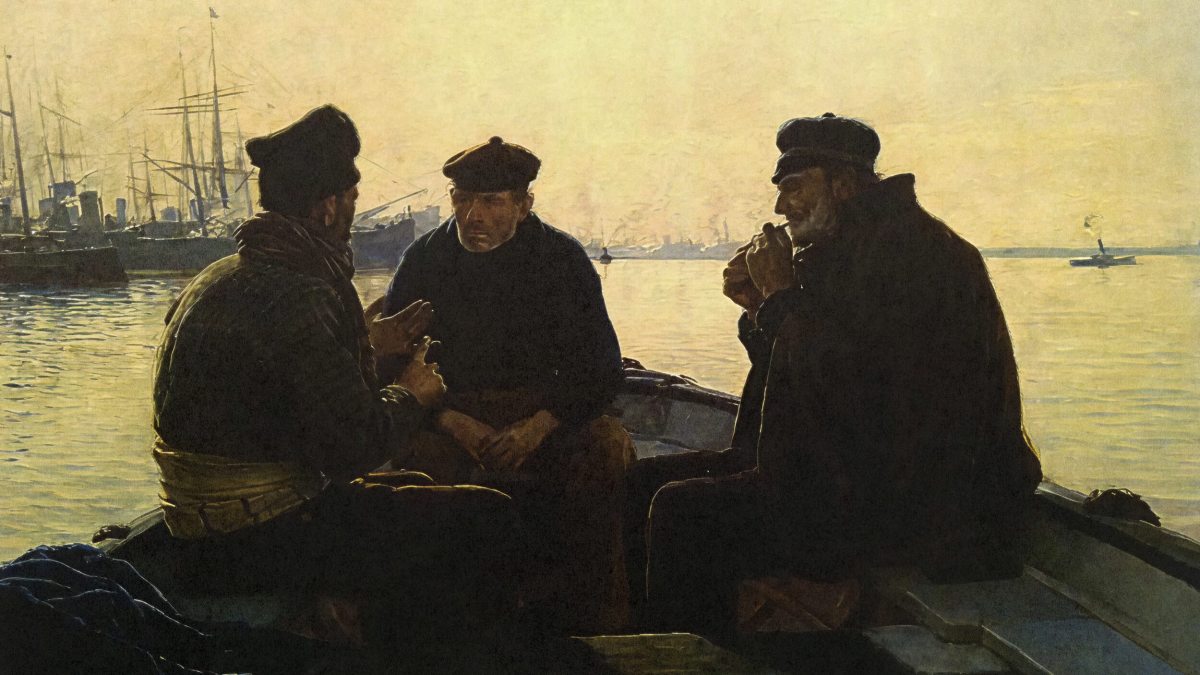 Three men in dark clothing sit and talk on a small boat in a harbor with ships and calm water in the background, under a hazy sky.