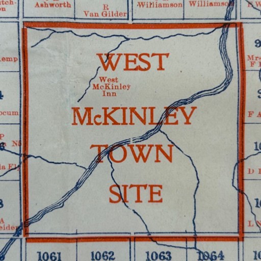 A section of a map labeled "West McKinley Town Site" with surrounding property names and numbers in blue and orange text.