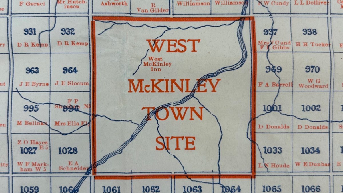 A section of a map labeled "West McKinley Town Site" with surrounding property names and numbers in blue and orange text.