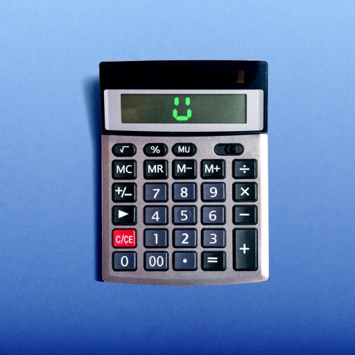 A calculator on a blue surface displays a smiling face on its screen.