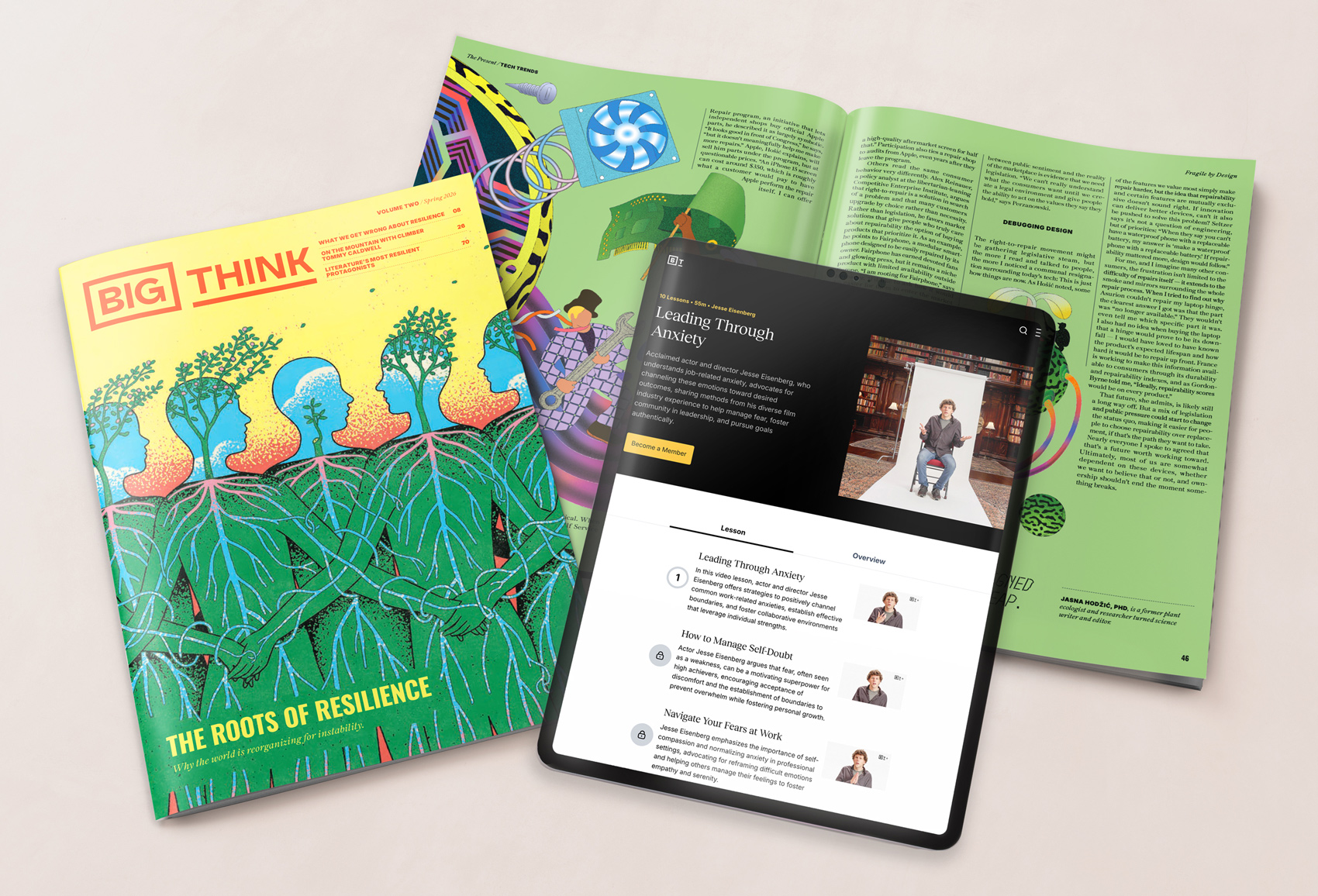 A magazine titled "Big Think," an open spread with illustrations and text, and a tablet displaying an online course called "Leading Through Anxiety" are arranged on a light surface.