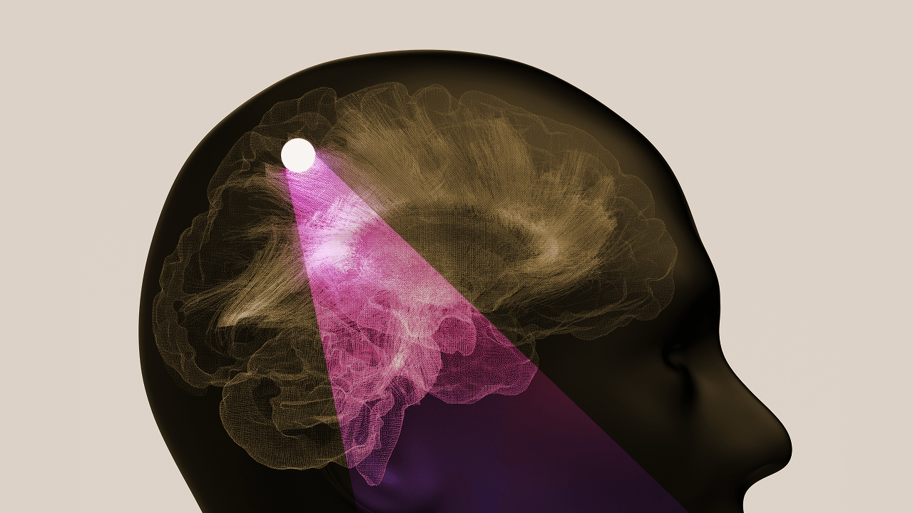 A digital illustration of a human head in profile showing a highlighted section of the brain with a bright light beam focused on a specific point inside the brain.