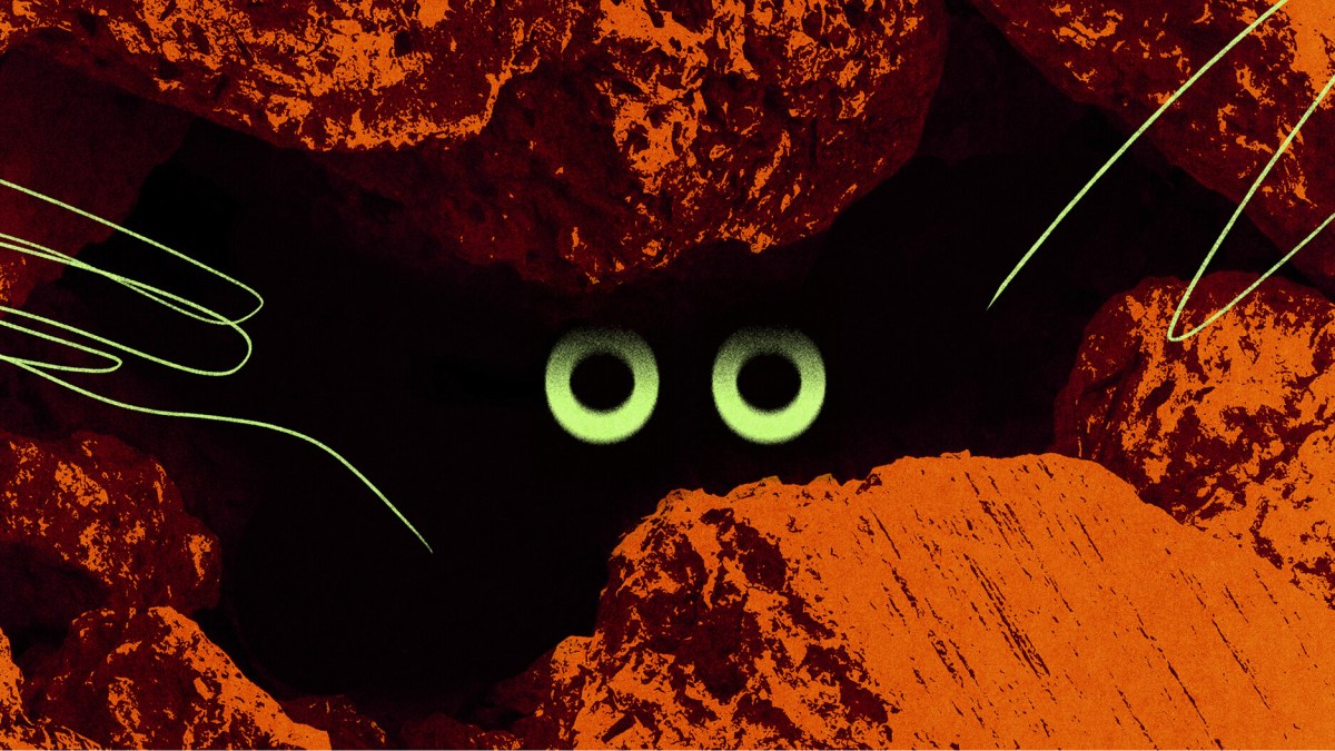Two glowing eyes peer out from a dark hole surrounded by rough, textured orange rocks with green lines.